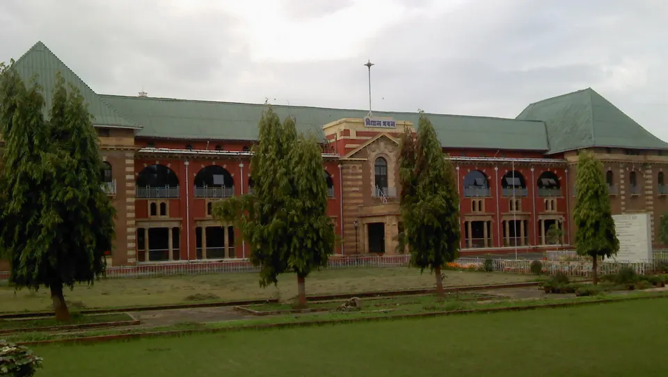 The red-brick Vidhan Bhavan building in Nagpur with its green roof and front lawn